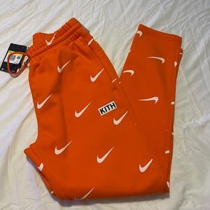 Brand new with tags NIKE X KITH NBA orange/white pants. Small
